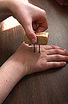 2 point set up touching back of hand
